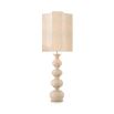 A sophisticated travertine table lamp by Eichholtz with a bulbous base and unique shaped shade