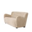 Cosy canberra sand upholstered sofa with sumptuous curves and deep stitching details