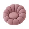 A luxurious swivel chair by Eichholtz with a flower-like design and brushed brass base