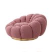 A luxurious swivel chair by Eichholtz with a flower-like design and brushed brass base