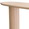 A gorgeous console table by Eichholtz with a natural finish and asymmetrical legs