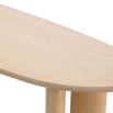 A gorgeous console table by Eichholtz with a natural finish and asymmetrical legs