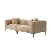 A luxury sofa by Eichholtz with a Lyssa sand upholstery and black legs