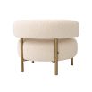 A glamorous chair by Eichholtz with a luxury upholstery and brushed brass legs 