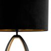 contemporary lamp in black and gold, long and oval in shape and with an elegant hollow centre