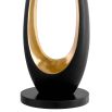 contemporary lamp in black and gold, long and oval in shape and with an elegant hollow centre