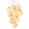 Elegant chandelier featuring suspended orb design and brass plate