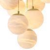 Elegant chandelier featuring suspended orb design and brass plate