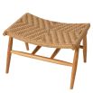 A stylish rattan outdoor chair and footstool by Eichholtz 