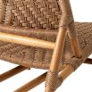 A stylish rattan outdoor chair and footstool by Eichholtz 