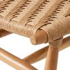 A stylish set of outdoor dining chairs by Eichholtz with intricate woven patterning and a teak wood finish