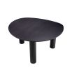 A luxurious black dining table by Eichholtz with a rounded table top 