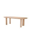 A lovely natural dining table by Eichholtz with playfully angled legs