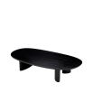 A sophisticated coffee table by Eichholtz with playfully asymmetrical legs and a beautiful black finish