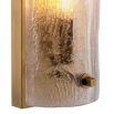 Glamorous brass wall lamp with textured glass shade