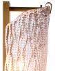 Glamorous brass wall lamp with textured glass shade