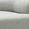 Stylish curved sofa upholstered in sleek grey upholstery