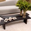 Tapered and narrow coffee table in black finish