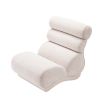 Luxurious padded lounge chair with horizontal fluting