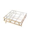 Square coffee table with geometric brass legs and glass top