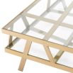 Square coffee table with geometric brass legs and glass top
