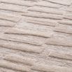 Large beige rug with rectangular textural detailing 