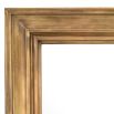 Mirror with large, bold frame in a vintage brass finish 