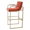 orange linen upholstered barstool with horizontal fluting and brass frame