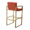 orange linen upholstered barstool with horizontal fluting and brass frame