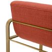orange linen upholstered barstool with horizontal fluting and brass frame