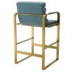 blue linen upholstered counter stool with horizontal fluting and brass frame