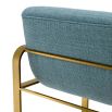 blue linen upholstered counter stool with horizontal fluting and brass frame