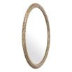 Round wall mirror with artisanal leaves pattern finished in vintage brass