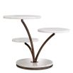 Three level cake stand with white marble bases and bronze finishes