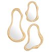 Organic shape set of three mirrors boasting fluid gold-finished frames