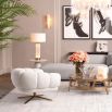 Side lamp with delicate glass columns surrounding the base and white shade