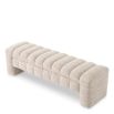 A contemporary bench by Eichholtz with a stunning sand coloured upholstery 