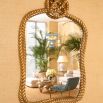 Antique gold mirror with unique rope detail crown