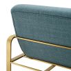 blue linen upholstered armchair with horizontal fluting and brass frame