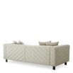 Upholstered modern sofa with chevron stitching detail