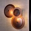 Gorgeous wall light featuring frosted glass and antique brass accents