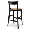 A stylish barstool by Eichholtz with a black composition and rattan seat