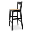 A stylish barstool by Eichholtz with a black composition and rattan seat