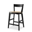 A stylish counter stool by Eichholtz with a black composition and rattan seat