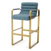 blue linen upholstered bar stools with horizontal fluting and brass frame