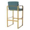 blue linen upholstered bar stools with horizontal fluting and brass frame