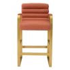 orange linen upholstered counter stool with horizontal fluting and brass frame