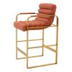orange linen upholstered counter stool with horizontal fluting and brass frame