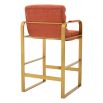 orange linen upholstered counter stool with horizontal fluting and brass frame