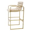 Cream linen upholstered bar stool with horizontal fluting and brass frame